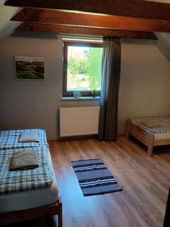 Posteľ alebo postele v izbe v ubytovaní Dom Mazurska Apartamenty