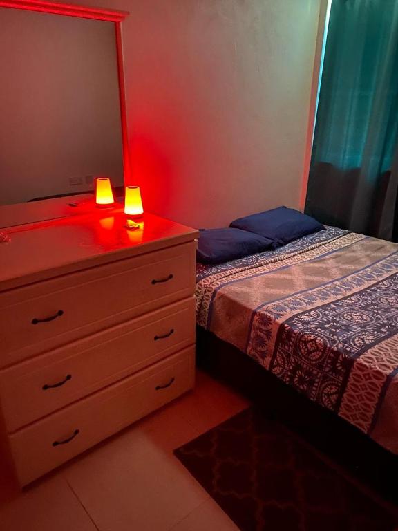 Postel nebo postele na pokoji v ubytování Paradise Living Apartment