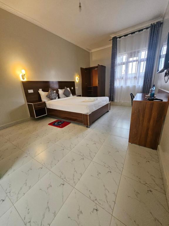 Postel nebo postele na pokoji v ubytování Grand Amoena Guest house