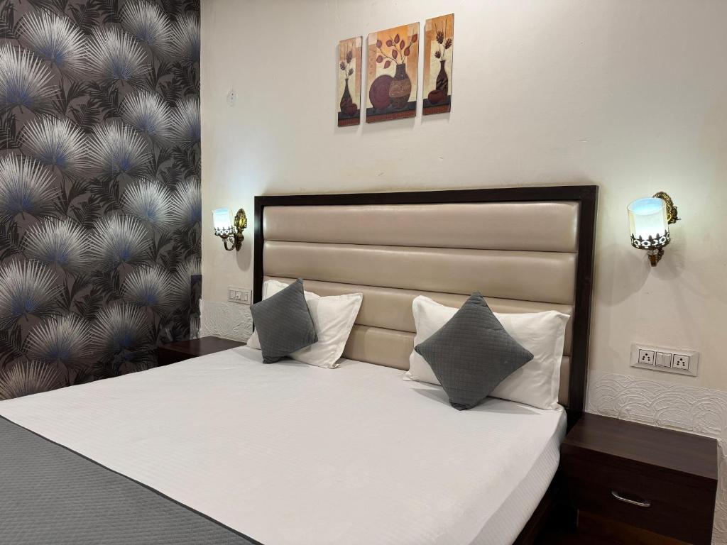 Postel nebo postele na pokoji v ubytování Hotel Sparkle Inn