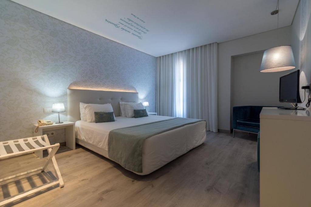 Postel nebo postele na pokoji v ubytování Costa de Prata Hotel