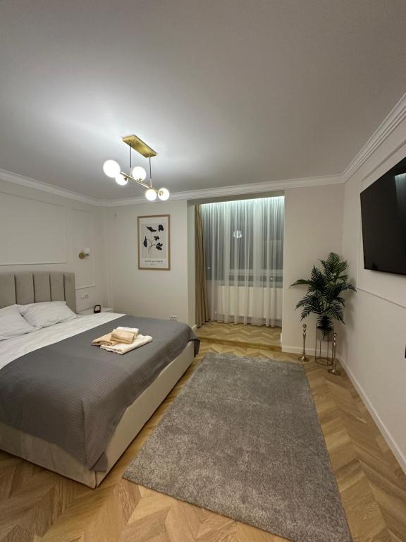 En eller flere senge i et værelse på Luxury Apartaments 0 Ultracentral Center