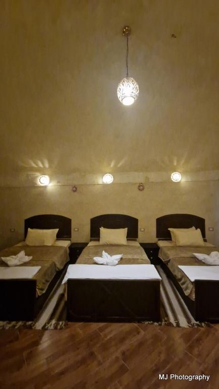 Postel nebo postele na pokoji v ubytování Hotel Talid