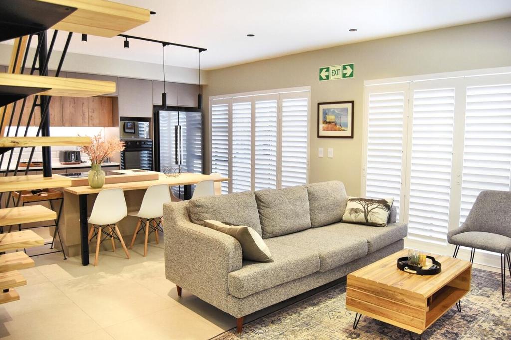 a living room with a couch and a table at Rustic Hills #7 Self-catering in Swakopmund