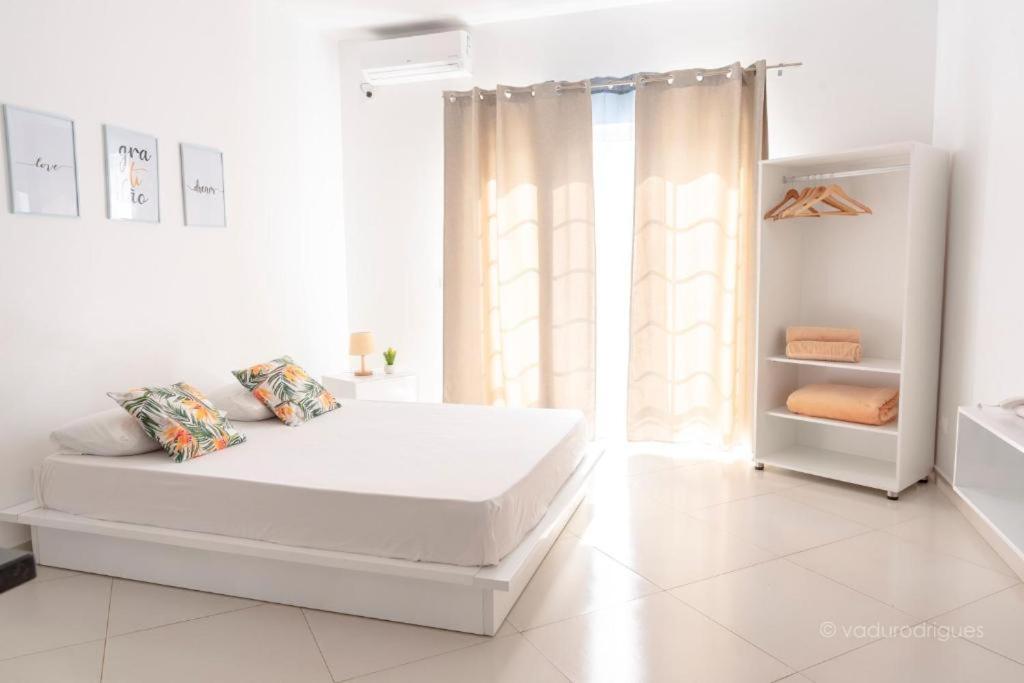 Postel nebo postele na pokoji v ubytování Urban Praia Maria - ApartHotel