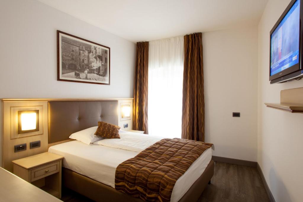 Postel nebo postele na pokoji v ubytování Hotel Portici - Romantik & Wellness