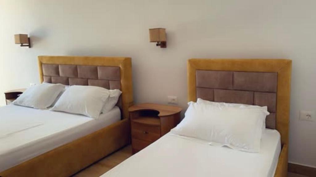 Postel nebo postele na pokoji v ubytování Grand Resort by Greccia Dhermi Prime
