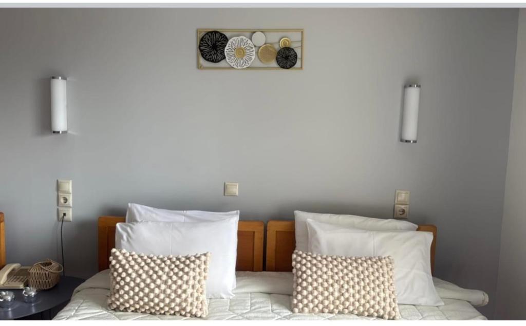 Postel nebo postele na pokoji v ubytování Hotel Rodini