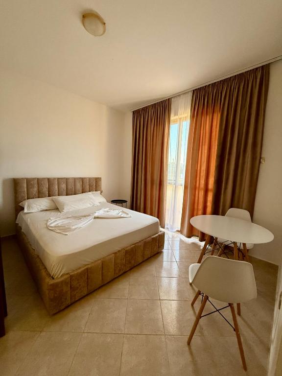 Postel nebo postele na pokoji v ubytování Hotel Ermi