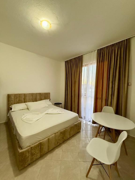 Postel nebo postele na pokoji v ubytování Hotel Ermi