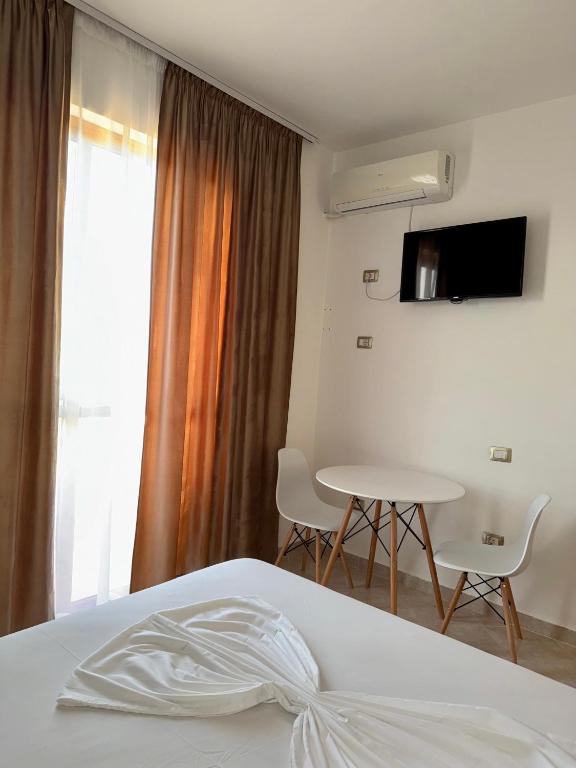 TV a/nebo společenská místnost v ubytování Hotel Ermi