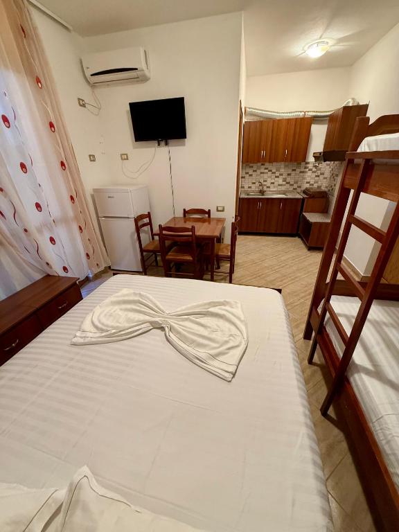 Postel nebo postele na pokoji v ubytování Hotel Ermi