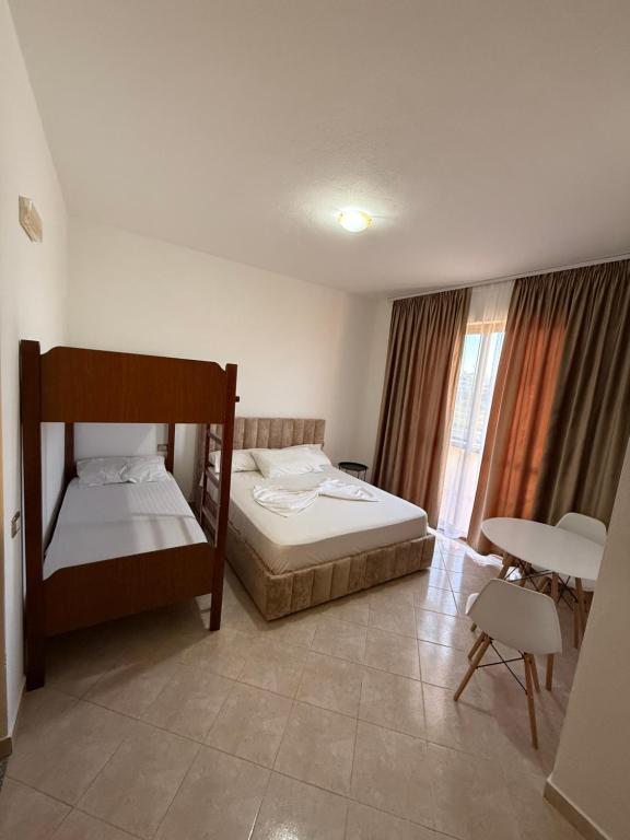 Postel nebo postele na pokoji v ubytování Hotel Ermi