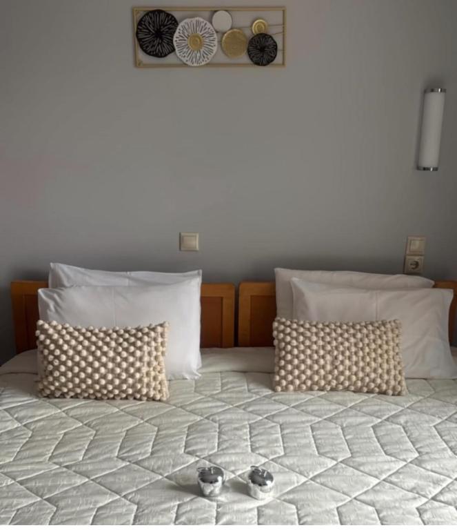 Postel nebo postele na pokoji v ubytování Hotel Rodini