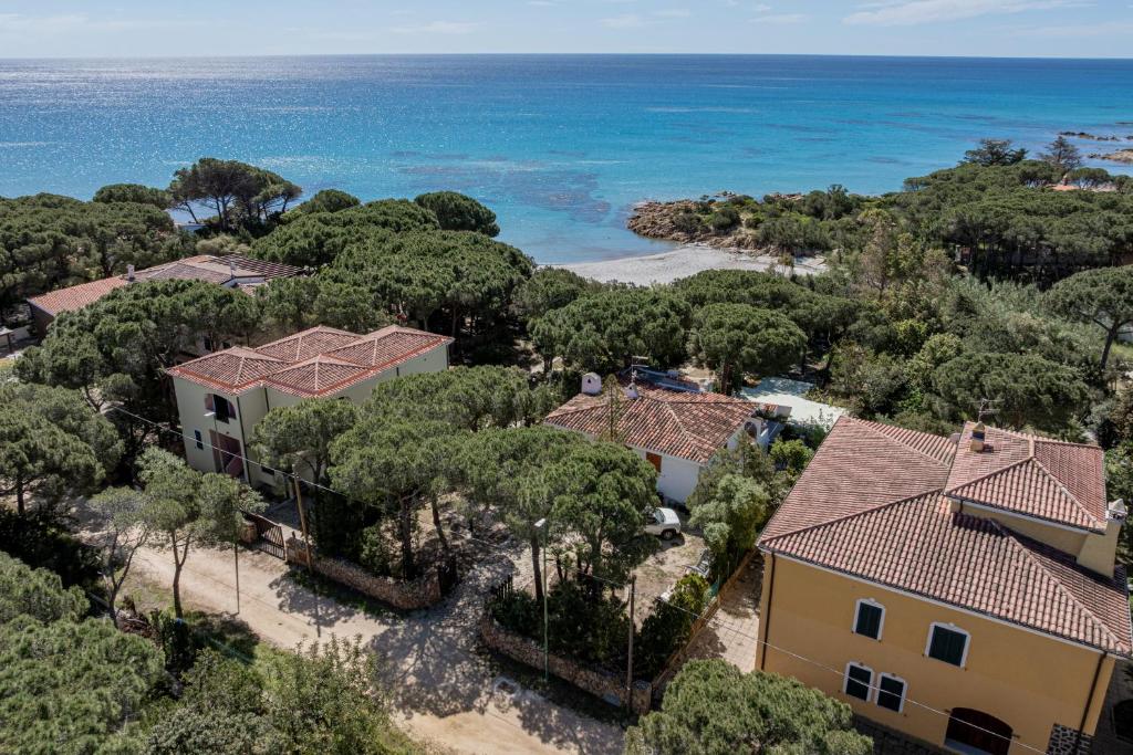 an aerial view of a house with the ocean in the background at Casa Donatella, in riva al mare! in Cala Liberotto