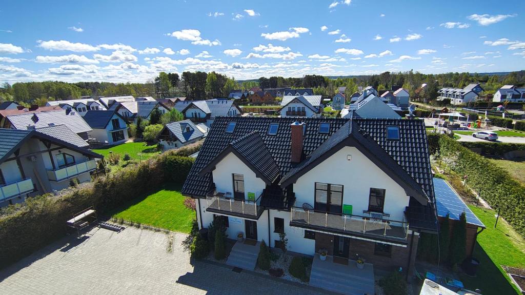 an overhead view of a house in a village at Villa Cork in Dębki