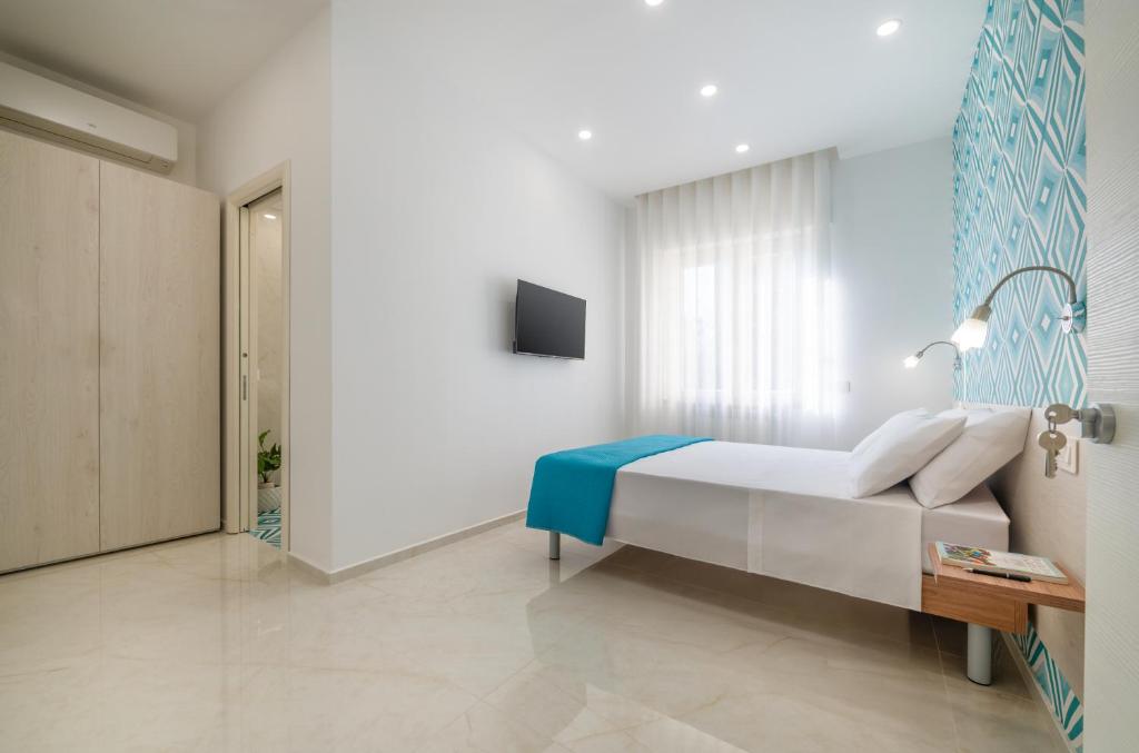 Postel nebo postele na pokoji v ubytování B&B Fiori D Arancio Sorrento