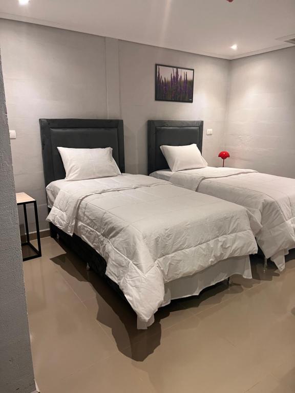Postel nebo postele na pokoji v ubytování Hotel margarita s