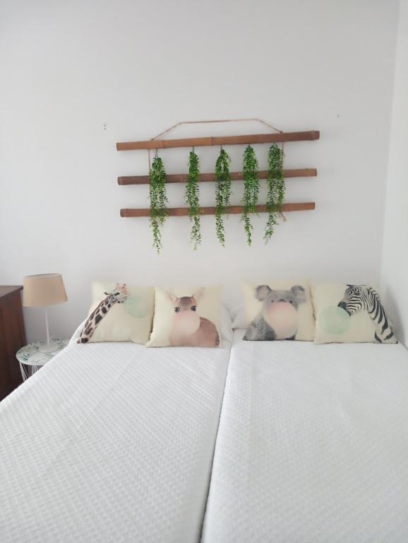 Posteľ alebo postele v izbe v ubytovaní CASA AMELIA Apartamento Bajo con terraza y jardín Apartamento 1ªPlanta