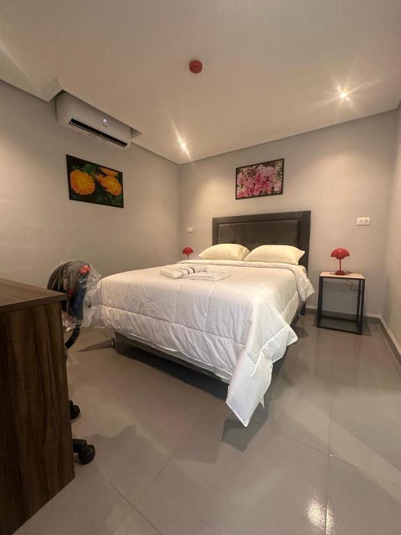 Postel nebo postele na pokoji v ubytování Hotel margarita s