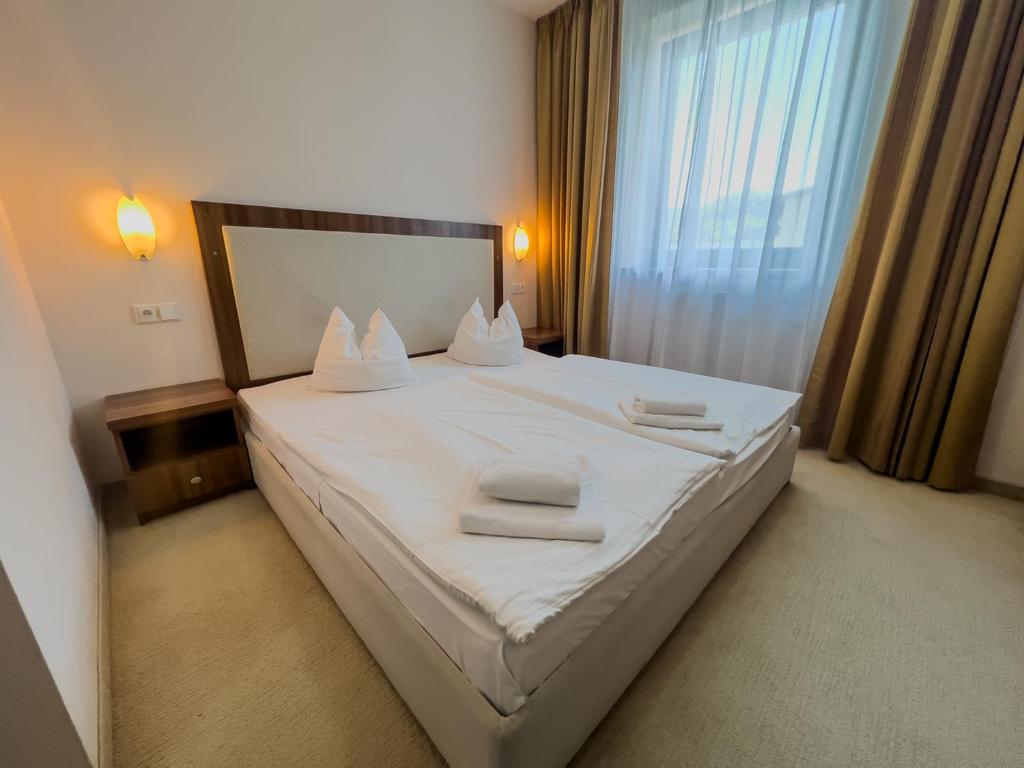 Postel nebo postele na pokoji v ubytování Hotel Arman