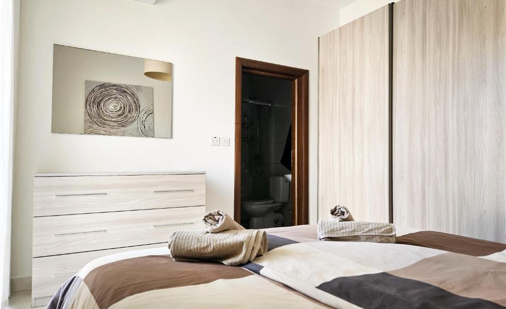 Postel nebo postele na pokoji v ubytování Calypso Apartment