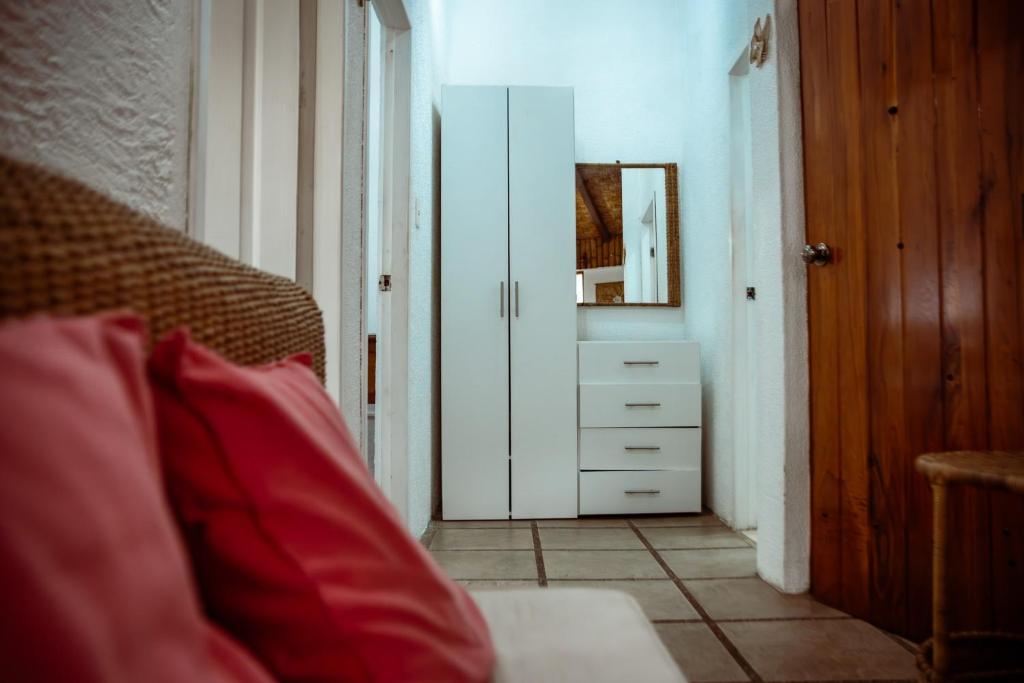 Postel nebo postele na pokoji v ubytování Hotel Miconia