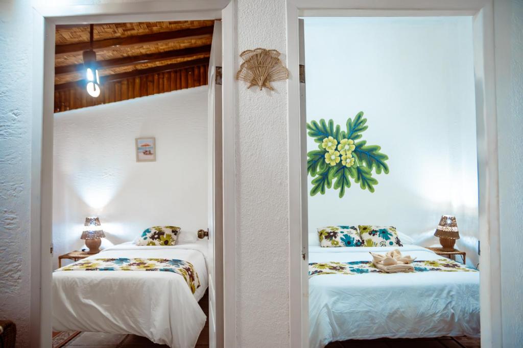 Postel nebo postele na pokoji v ubytování Hotel Miconia
