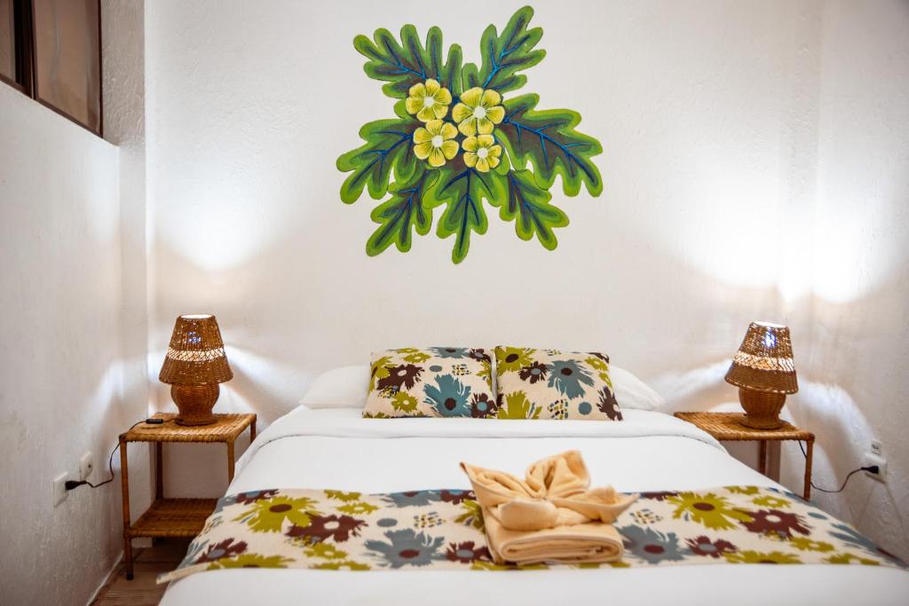 Postel nebo postele na pokoji v ubytování Hotel Miconia