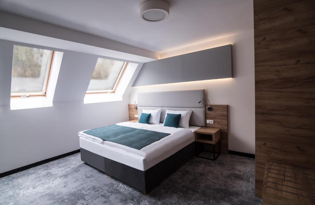 Postel nebo postele na pokoji v ubytování Hotel Limanova