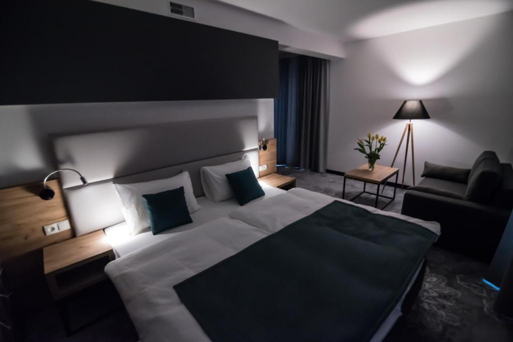 Postel nebo postele na pokoji v ubytování Hotel Limanova