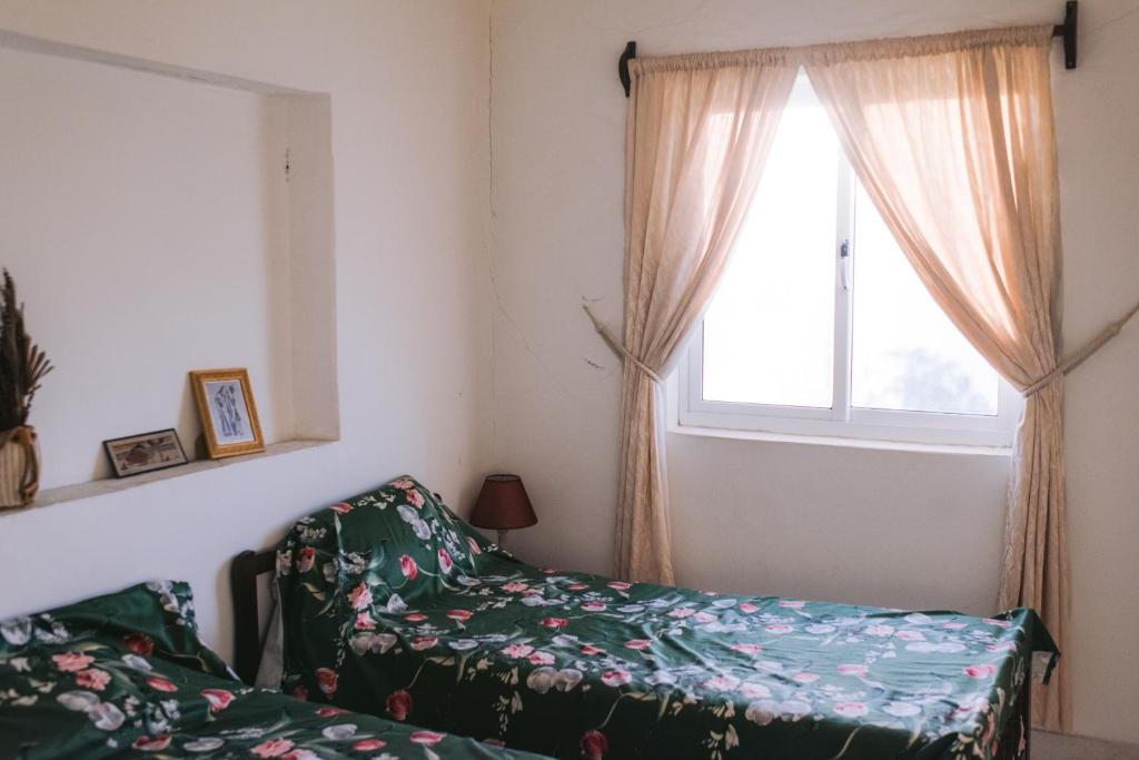 Postel nebo postele na pokoji v ubytování Casa Tota