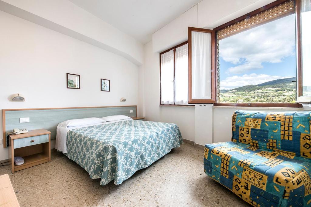 Postel nebo postele na pokoji v ubytování Stella Hotel
