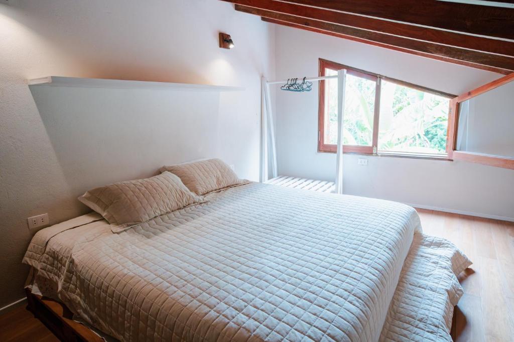 Postel nebo postele na pokoji v ubytování Casa BuenaOnda Asunción