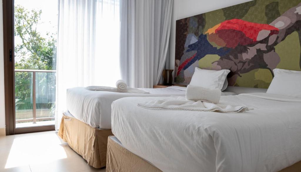 Ένα ή περισσότερα κρεβάτια σε δωμάτιο στο Ecoresort Capivari