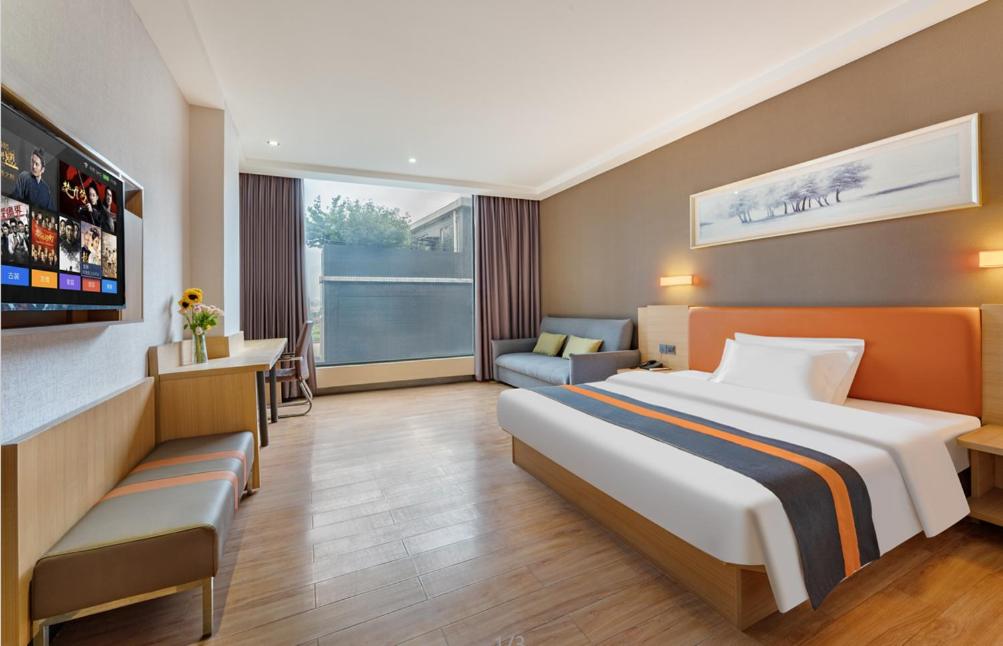 Postel nebo postele na pokoji v ubytování Yunli Boutique Hotel