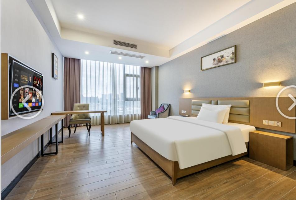 Postel nebo postele na pokoji v ubytování Yunli Boutique Hotel