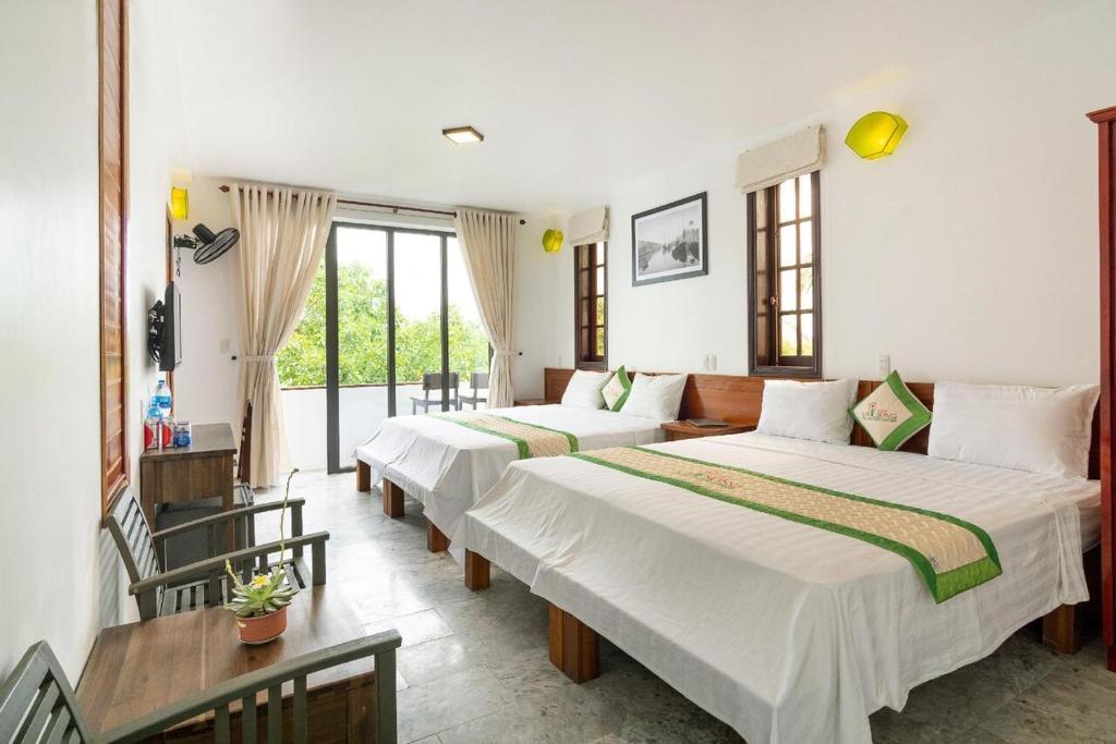 Postel nebo postele na pokoji v ubytování Fig Tree Boutique Villa