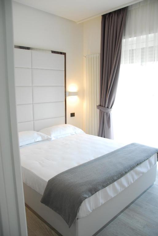 Posteľ alebo postele v izbe v ubytovaní LHP Suite Rapallo