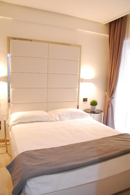 Posteľ alebo postele v izbe v ubytovaní LHP Suite Rapallo