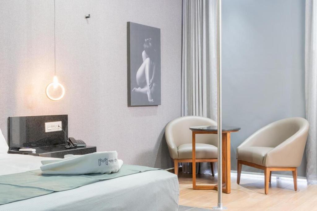 Postel nebo postele na pokoji v ubytování Motel Millenium