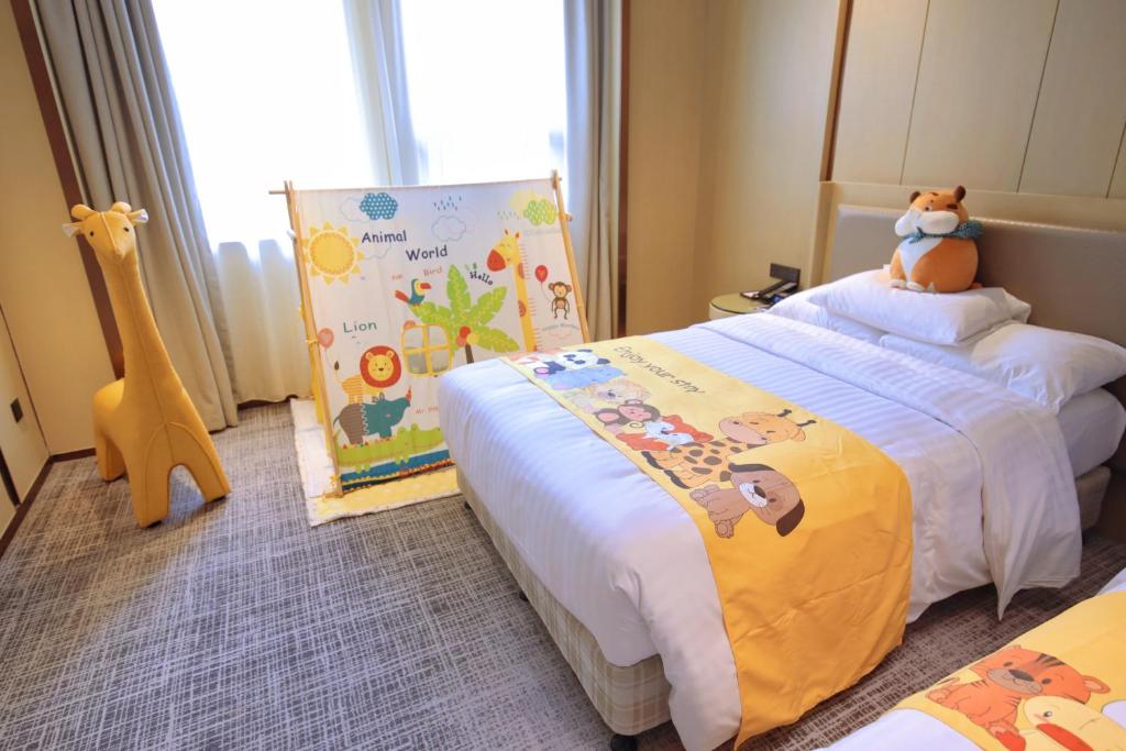 Postel nebo postele na pokoji v ubytování Courtyard by Marriott Shanghai International Tourism and Resorts Zone