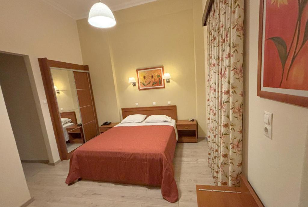 Postel nebo postele na pokoji v ubytování Hotel Kronio
