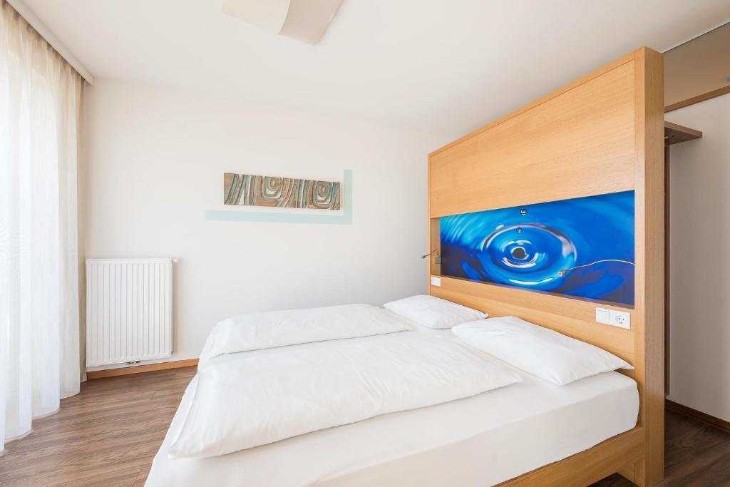 Postel nebo postele na pokoji v ubytování Residence Aqualis
