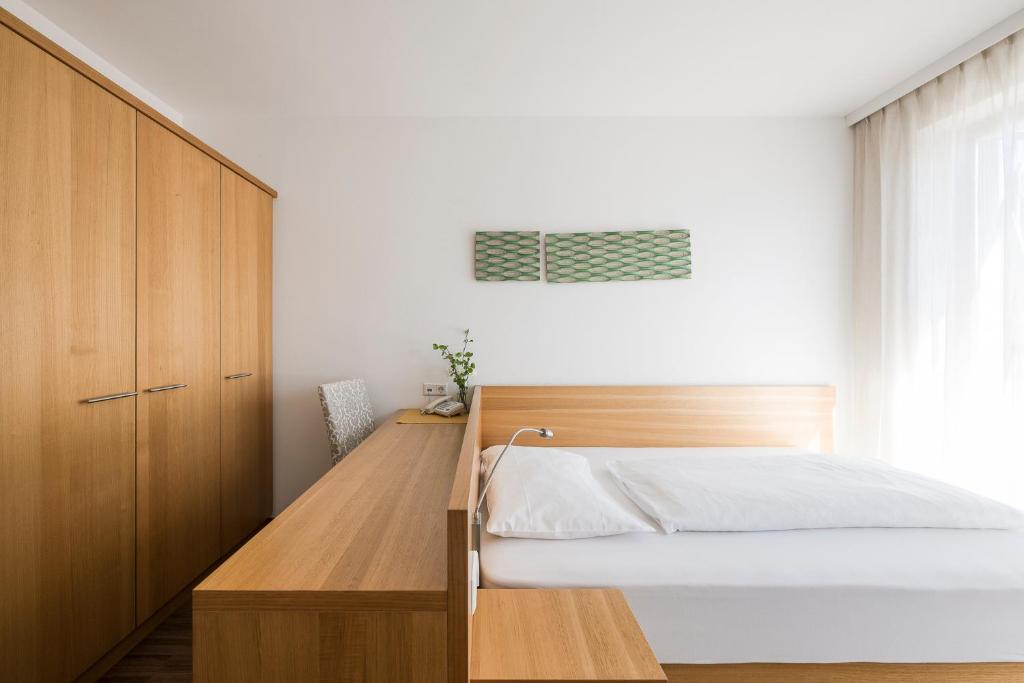 Postel nebo postele na pokoji v ubytování Residence Aqualis