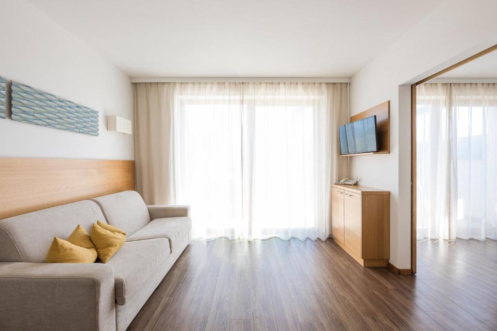 TV a/nebo společenská místnost v ubytování Residence Aqualis