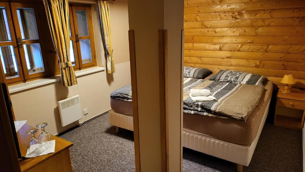 Postel nebo postele na pokoji v ubytování Klostermannova chata