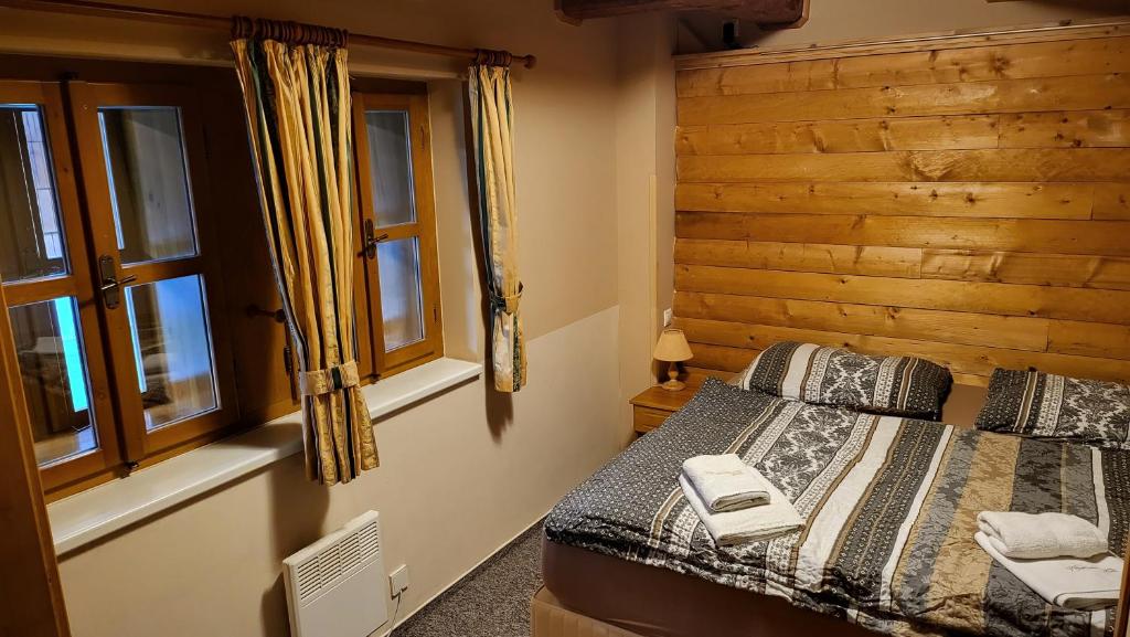Postel nebo postele na pokoji v ubytování Klostermannova chata