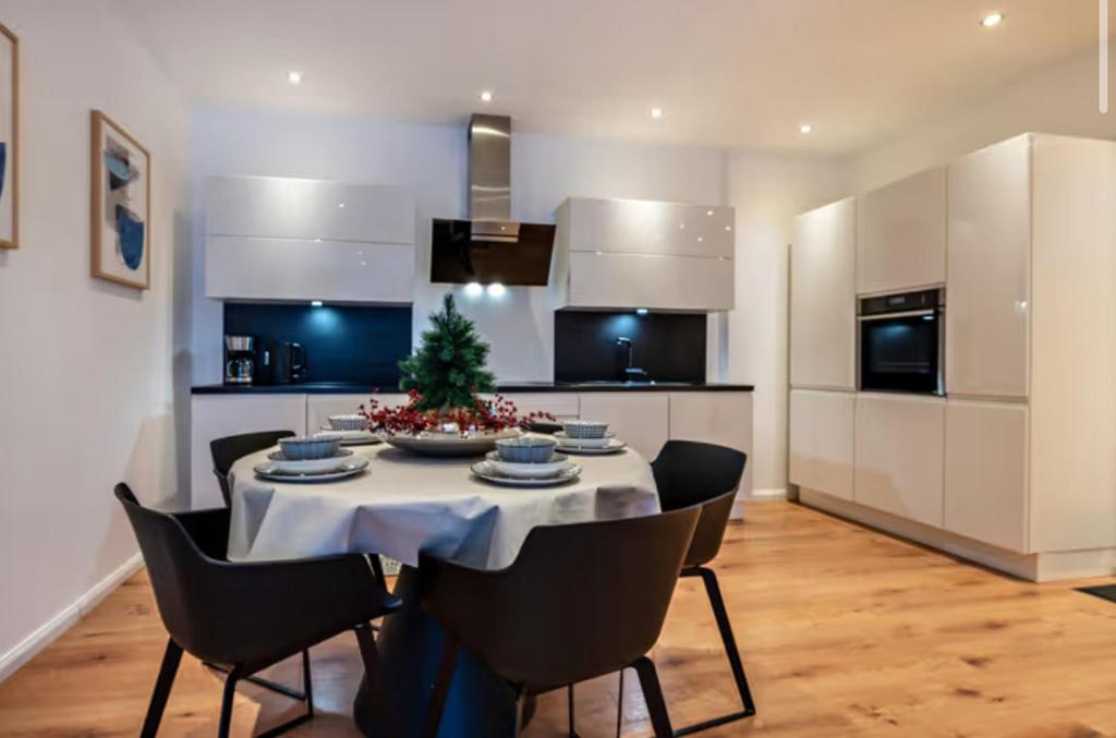 a kitchen with a table with a christmas tree on it at Casa Caso in Achim