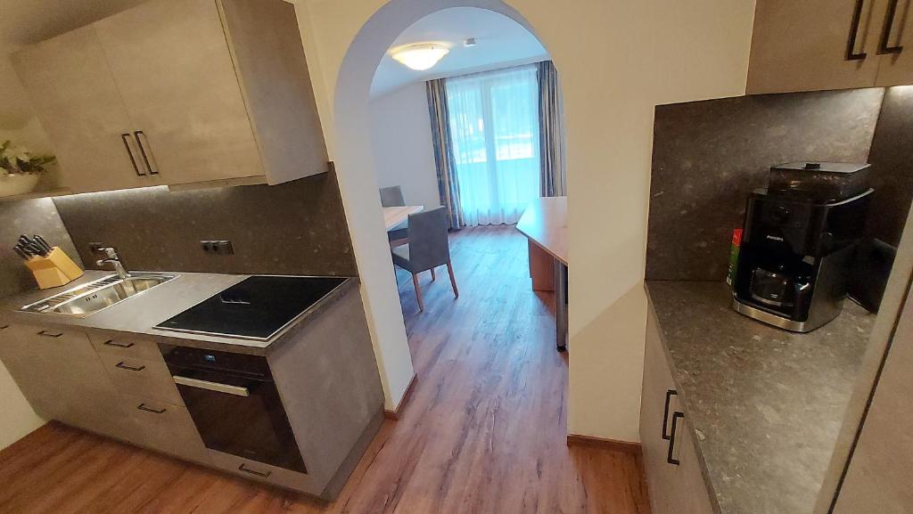 Kuchyň nebo kuchyňský kout v ubytování Zeitlos Apartments